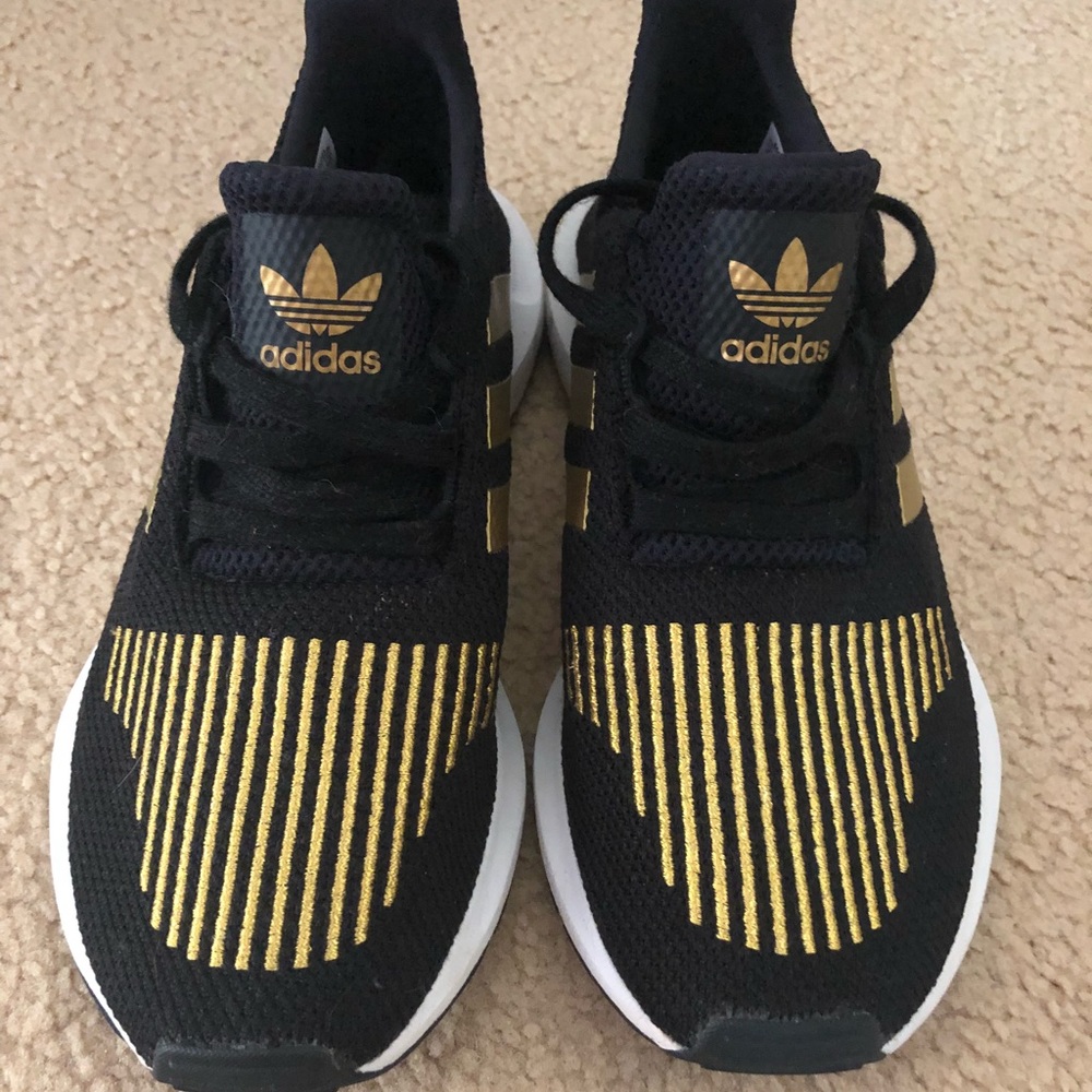 Women’s black and gold adidas shoes